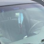 Hanging masks on rearview mirror